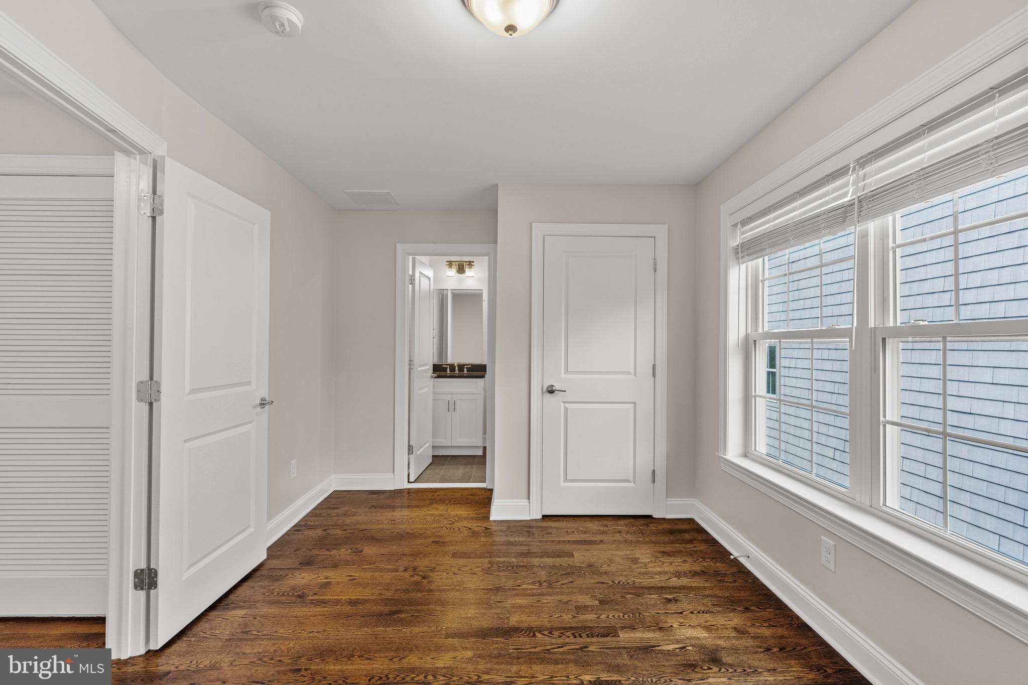 303 # 2 Witherspoon Street Princeton, NJ 08542 - Photo 13 of 31 a view of an empty room with window and wooden floor