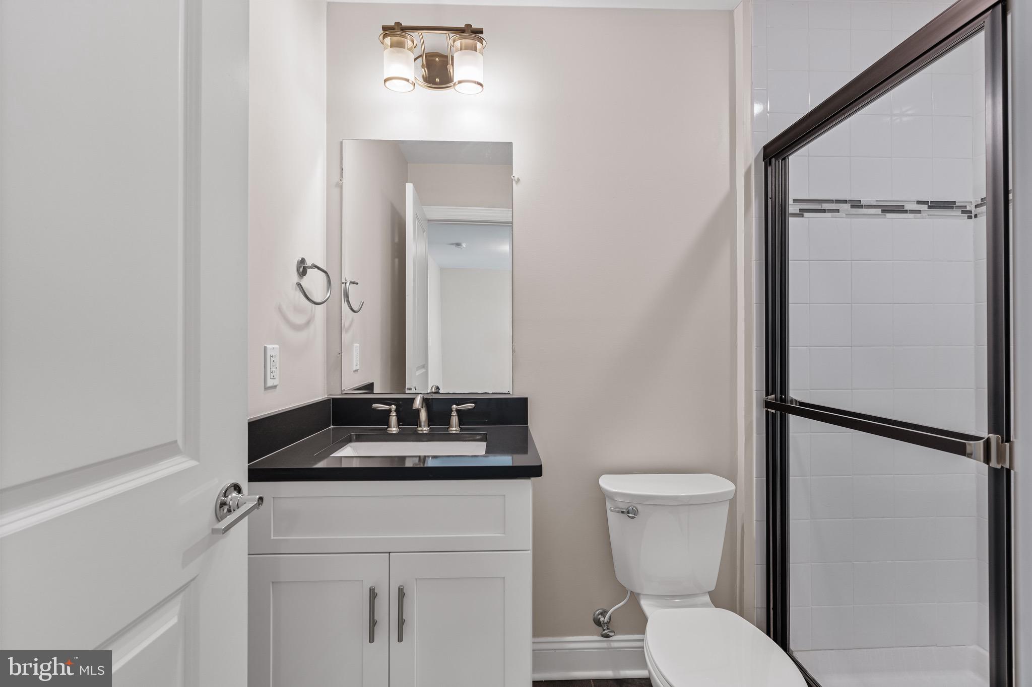 303 # 2 Witherspoon Street Princeton, NJ 08542 - Photo 15 of 31 a bathroom with a sink toilet and shower