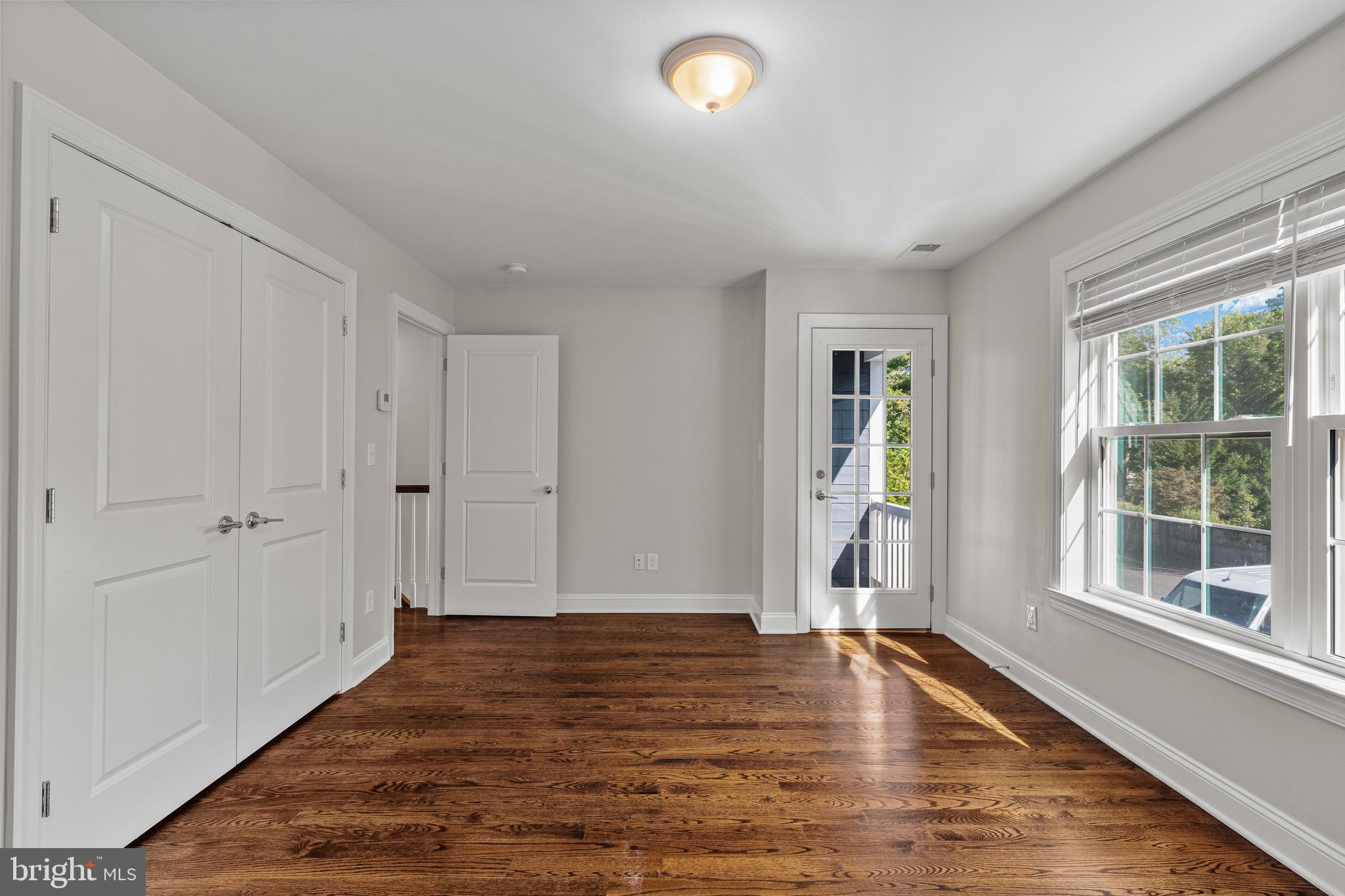 303 # 2 Witherspoon Street Princeton, NJ 08542 - Photo 18 of 31 a view of an empty room with window and wooden floor