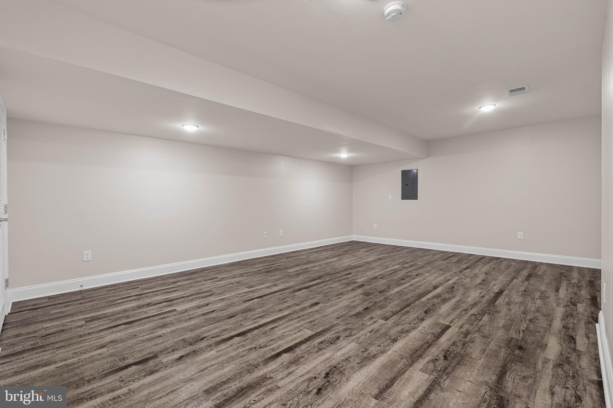 303 # 2 Witherspoon Street Princeton, NJ 08542 - Photo 26 of 31 a view of an empty room with wooden floor and windows