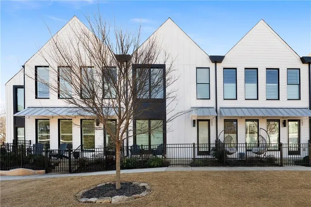 a front view of a building with garden