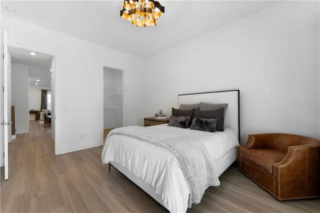 a bedroom with a bed and a couch