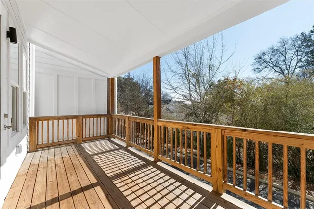 a balcony with wooden floor