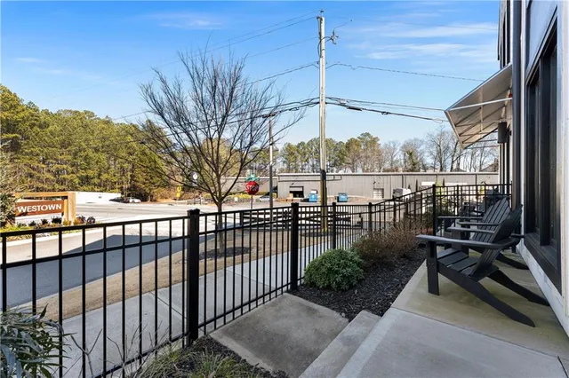 a view of a chairs and table in patio