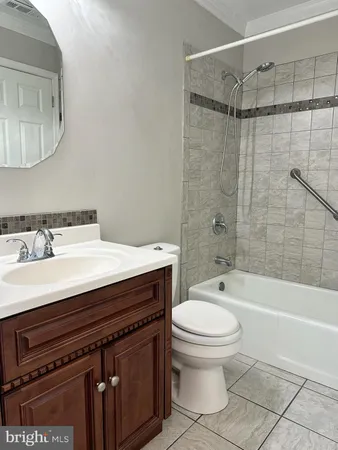 a bathroom with a sink a toilet and a bathtub