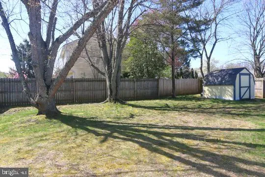 a house that has a tree in front of it