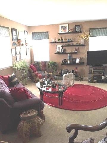 1429 Draper Road, Unit 1429 McHenry, IL 60050 - Photo 5 of 7 a living room with furniture and a table