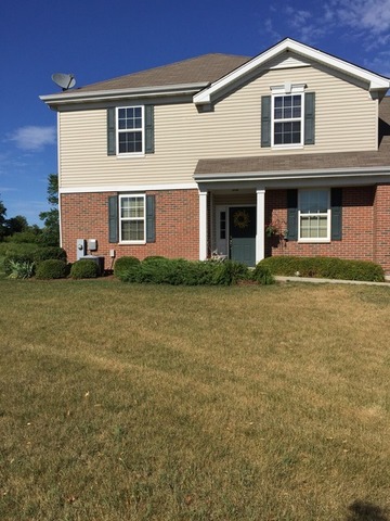 1429 Draper Road, Unit 1429 McHenry, IL 60050 - Photo 7 of 7 a front view of a house with garden