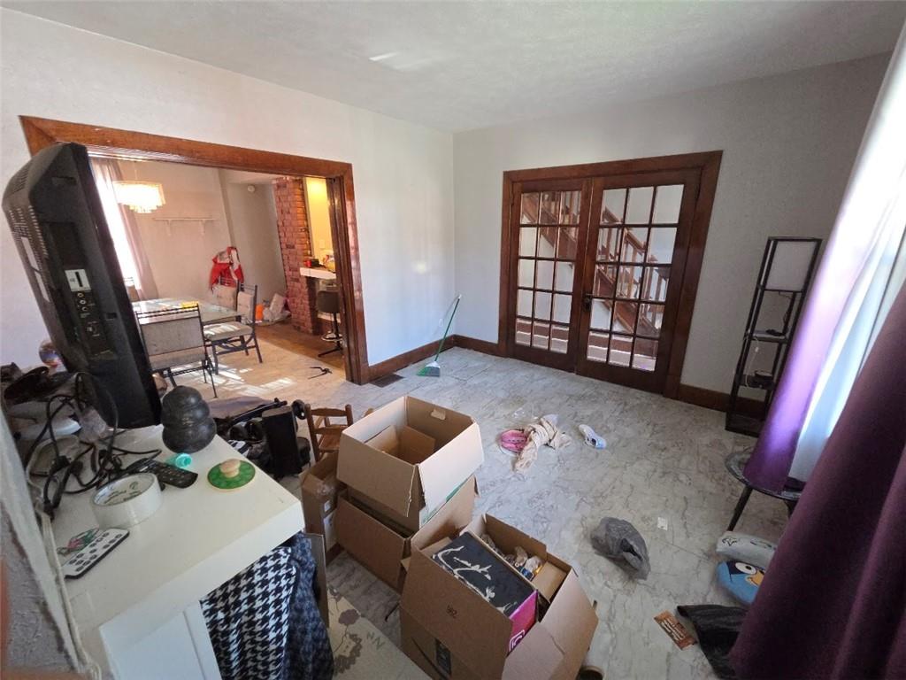 735 South 14th Street Monessen, PA 15062 - Photo 5 of 15 a living room with furniture a flat screen tv and a window