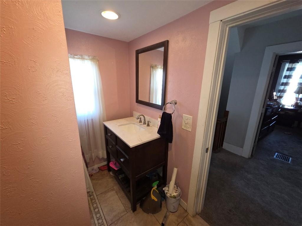 735 South 14th Street Monessen, PA 15062 - Photo 10 of 15 a view of a bathroom with sink and mirror