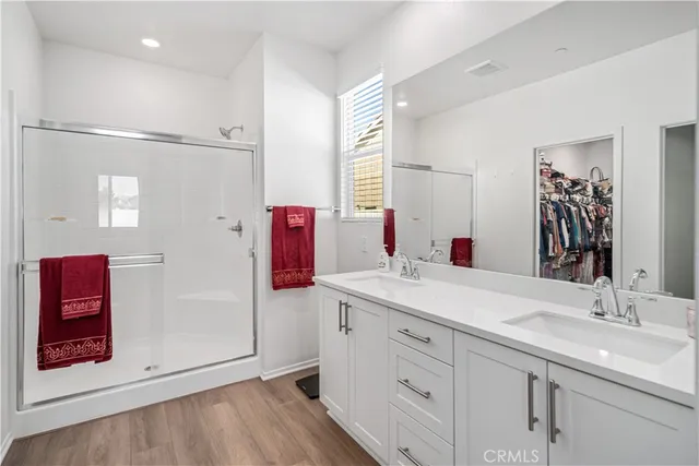 a bathroom with a sink vanity and mirror