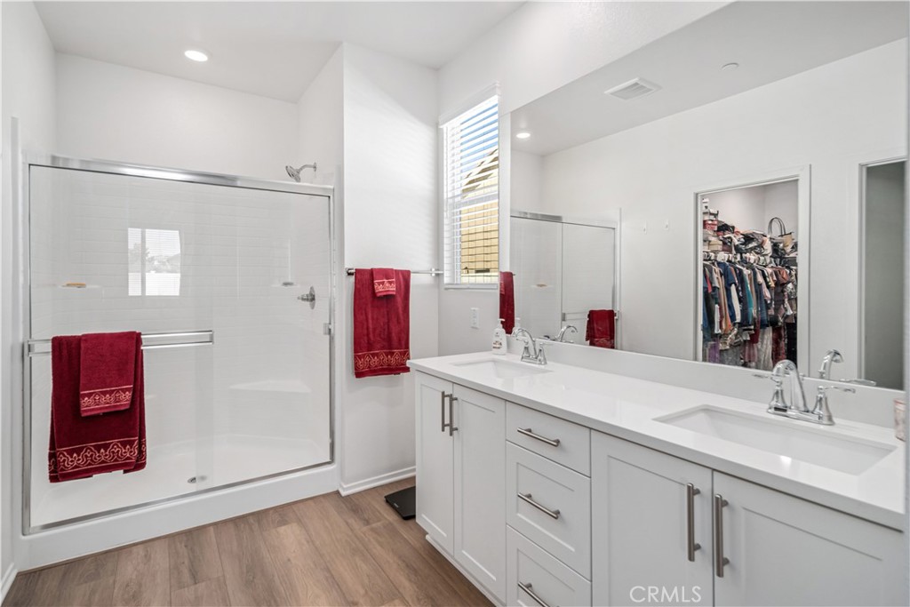 45628 Rachel Avenue Lancaster, CA 93535 - Photo 18 of 36 a bathroom with a sink vanity and mirror