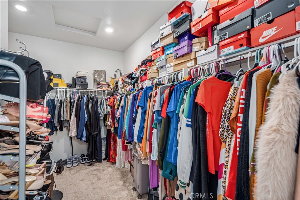 45628 Rachel Avenue Lancaster, CA 93535 - Photo 19 of 36 a view of walk in closet with clothes