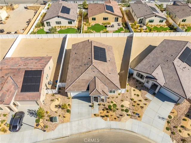 an aerial view of residential building with parking