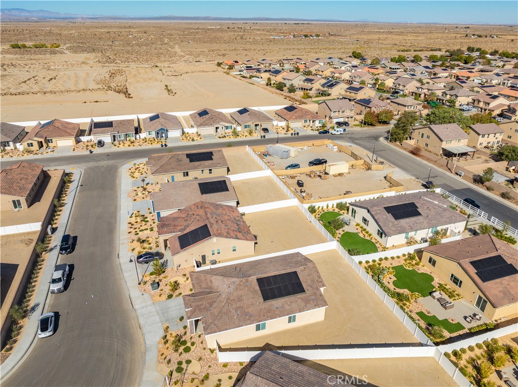 45628 Rachel Avenue Lancaster, CA 93535 - Photo 35 of 36 an aerial view of residential building with parking
