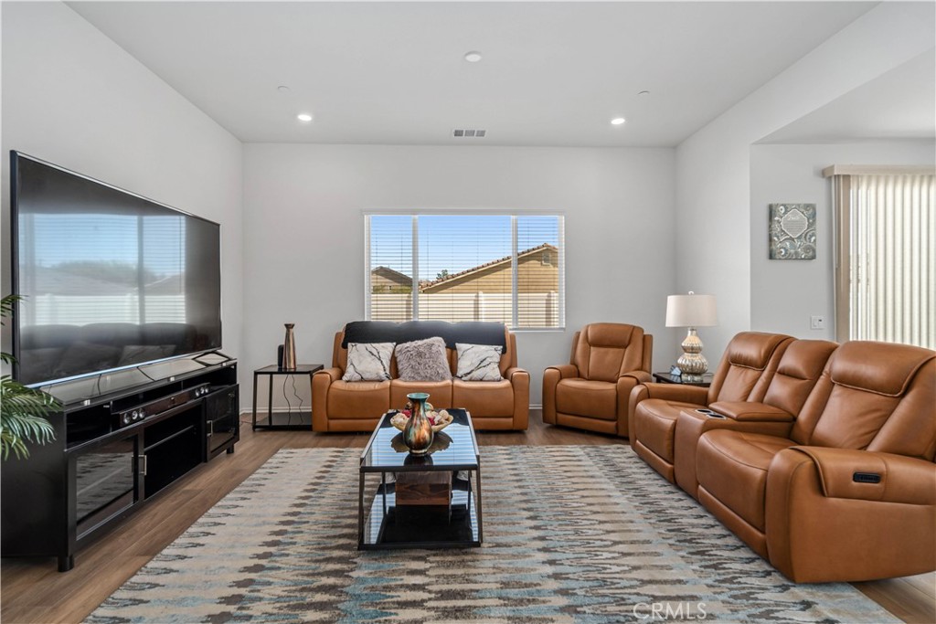 45628 Rachel Avenue Lancaster, CA 93535 - Photo 7 of 36 a living room with furniture and a flat screen tv