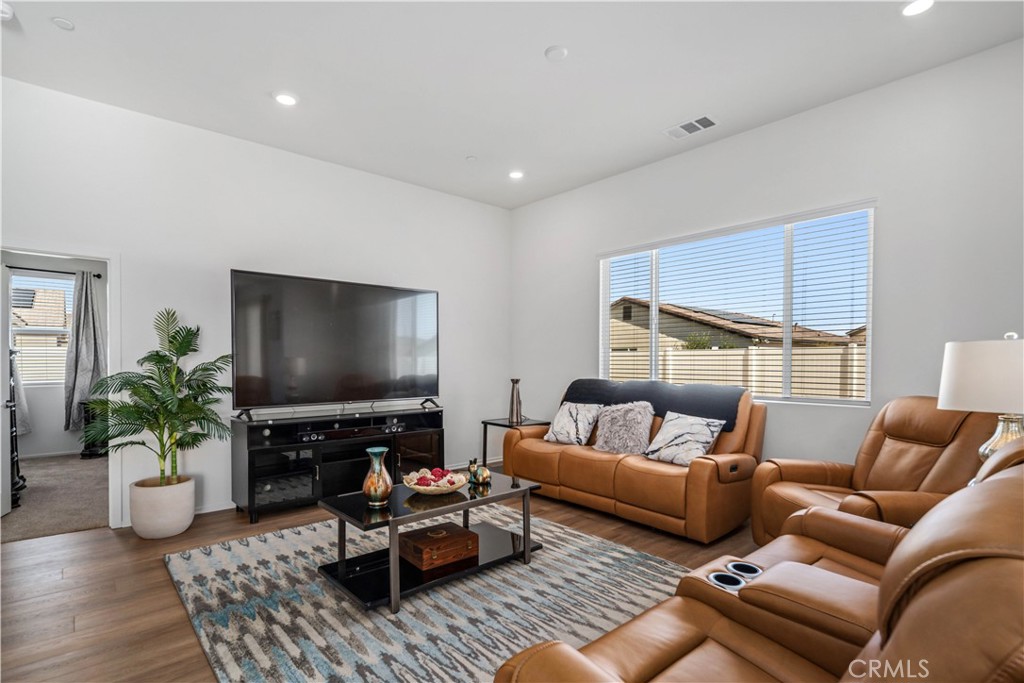 45628 Rachel Avenue Lancaster, CA 93535 - Photo 8 of 36 a living room with furniture and a flat screen tv