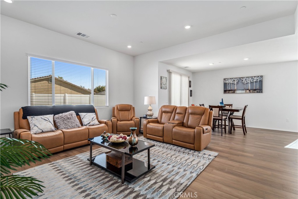 45628 Rachel Avenue Lancaster, CA 93535 - Photo 9 of 36 a living room with furniture wooden floor and window