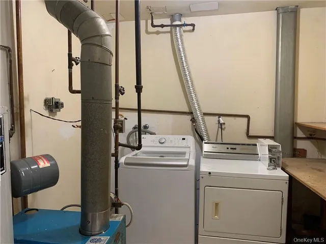 a view of bathroom with a washer and dryer
