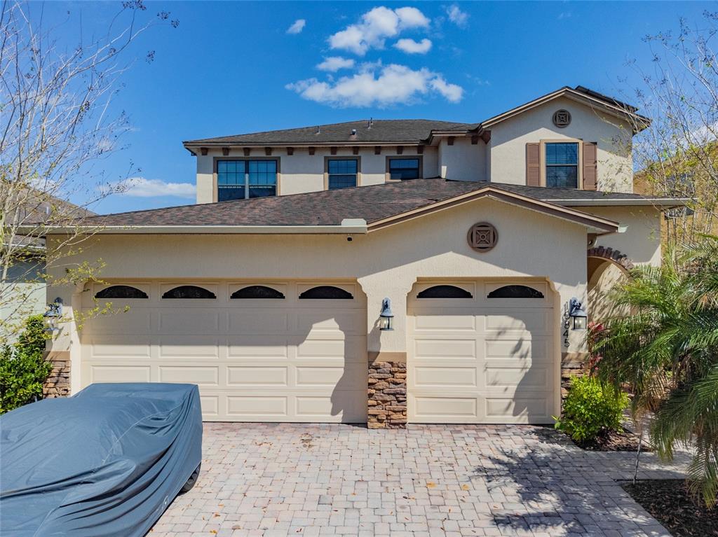 10845 Willow Ridge Loop Orlando, FL 32825 - Photo 1 of 1 a front view of a house with a yard