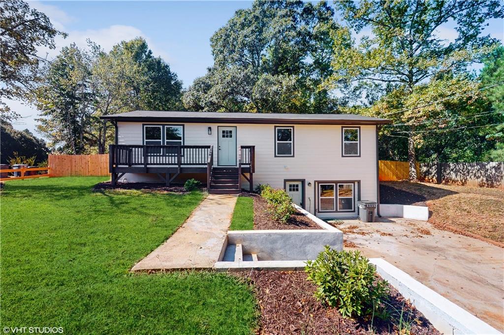 239 Rabbit Hill Road Dacula, GA 30019 - Photo 1 of 1 a view of a yard in front of a house
