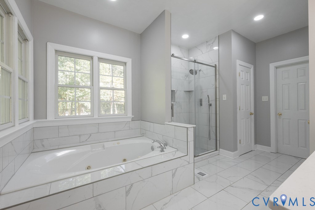 15438 West Patrick Henry Road Montpelier, VA 23192 - Photo 11 of 45 a bathroom with a bathtub and shower