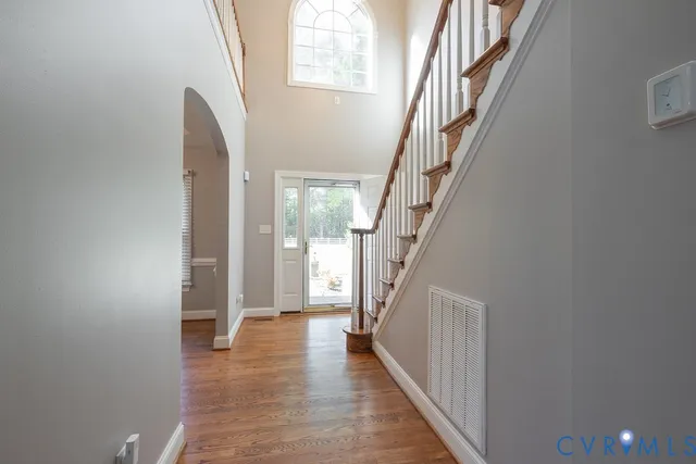 a view of an entryway with wooden floor
