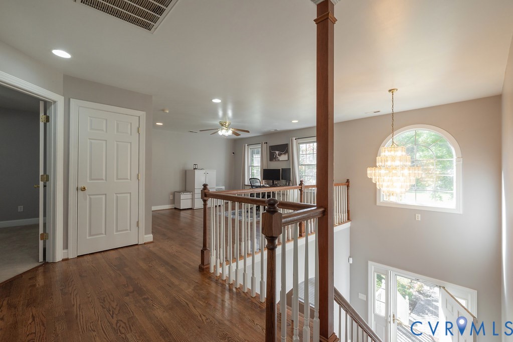 15438 West Patrick Henry Road Montpelier, VA 23192 - Photo 22 of 45 a view of a hallway with wooden floor and windows