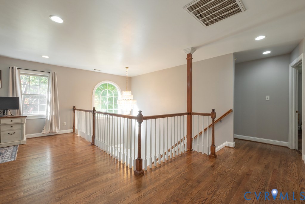 15438 West Patrick Henry Road Montpelier, VA 23192 - Photo 23 of 45 a view of a hallway with wooden floor and windows