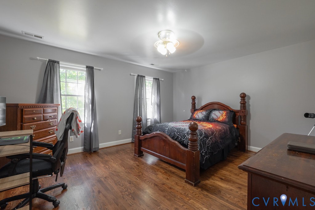 15438 West Patrick Henry Road Montpelier, VA 23192 - Photo 25 of 45 a bedroom with a bed and a desk