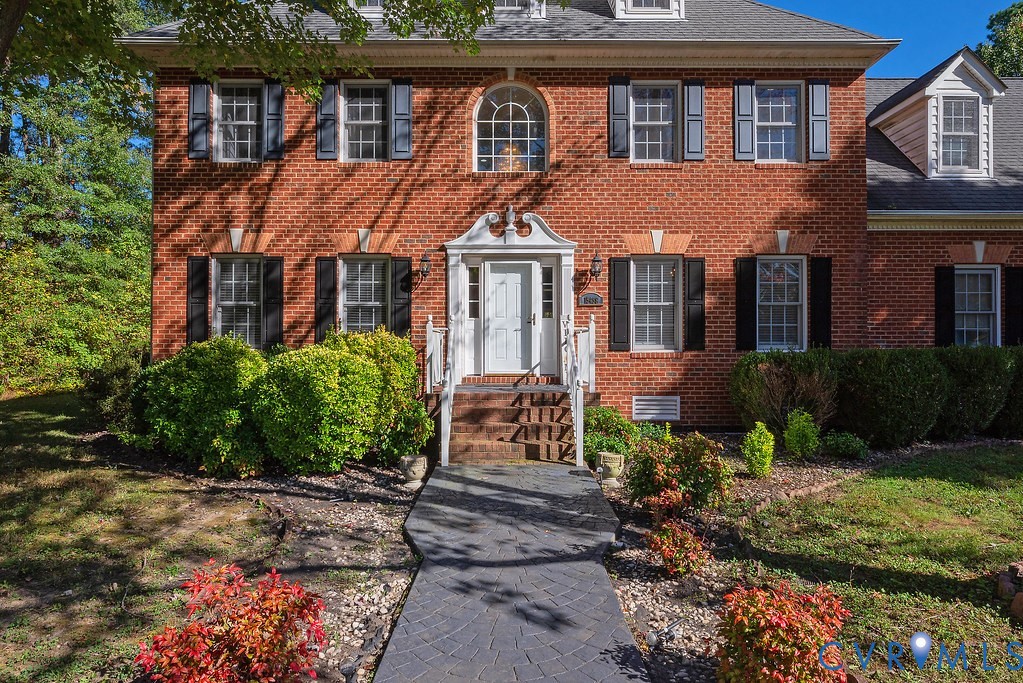 15438 West Patrick Henry Road Montpelier, VA 23192 - Photo 3 of 45 a front view of a house with garden