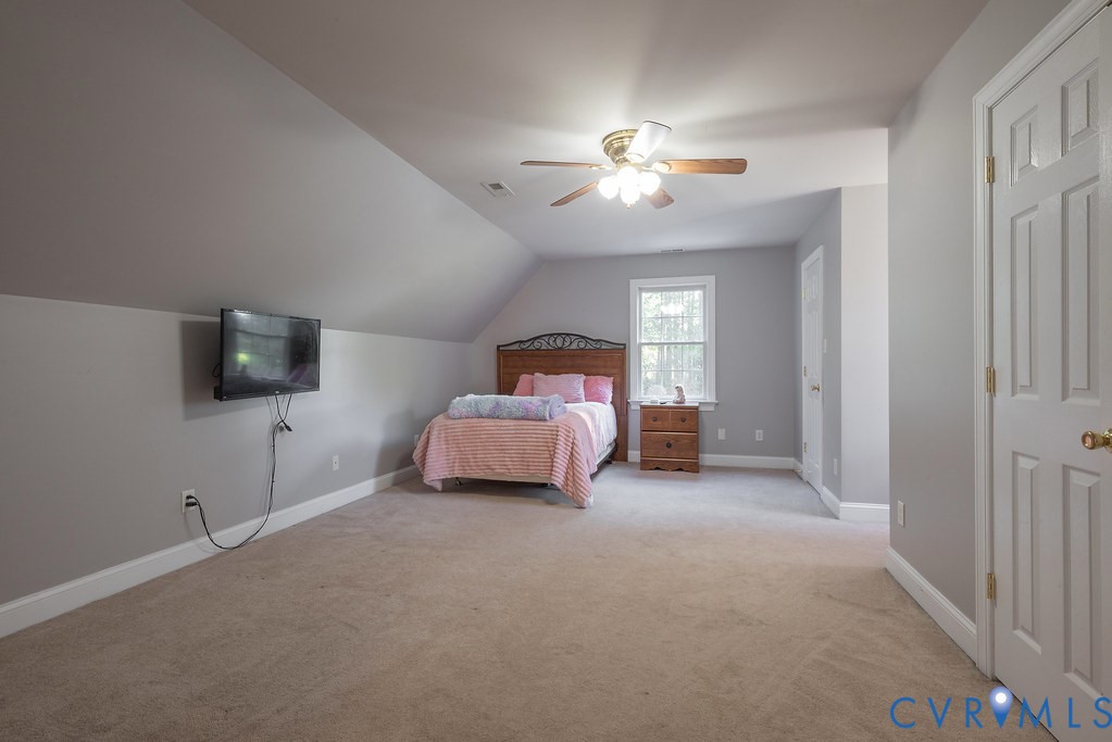 15438 West Patrick Henry Road Montpelier, VA 23192 - Photo 31 of 45 a room with a bed and a tv