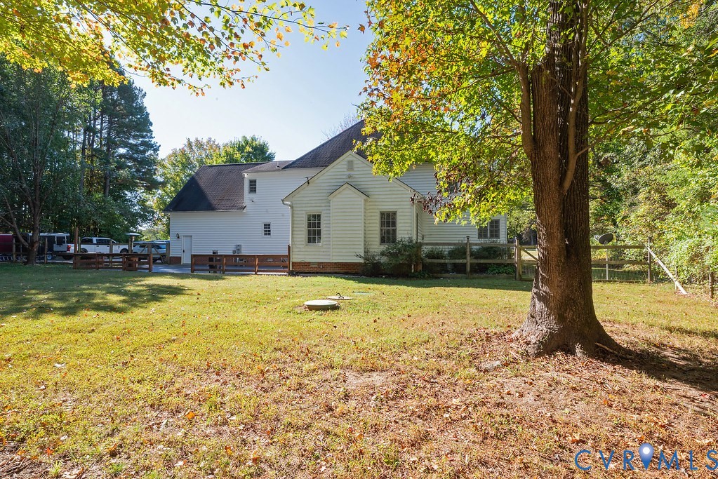 15438 West Patrick Henry Road Montpelier, VA 23192 - Photo 34 of 45 a house that has a big yard with large trees