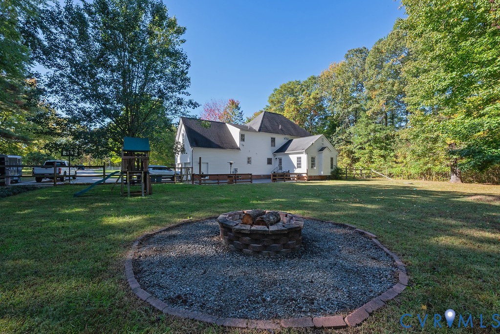 15438 West Patrick Henry Road Montpelier, VA 23192 - Photo 40 of 45 a view of a house with a yard