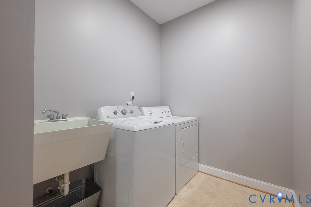 15438 West Patrick Henry Road Montpelier, VA 23192 - Photo 43 of 45 a utility room with dryer and washer