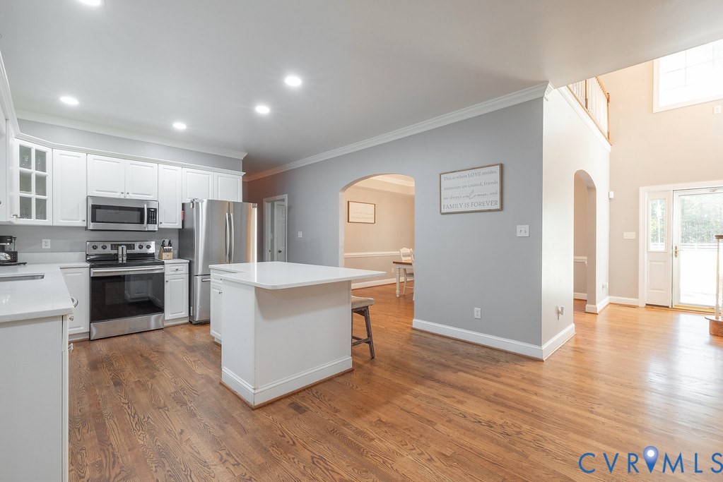 15438 West Patrick Henry Road Montpelier, VA 23192 - Photo 5 of 45 a kitchen with stainless steel appliances a refrigerator and a stove top oven