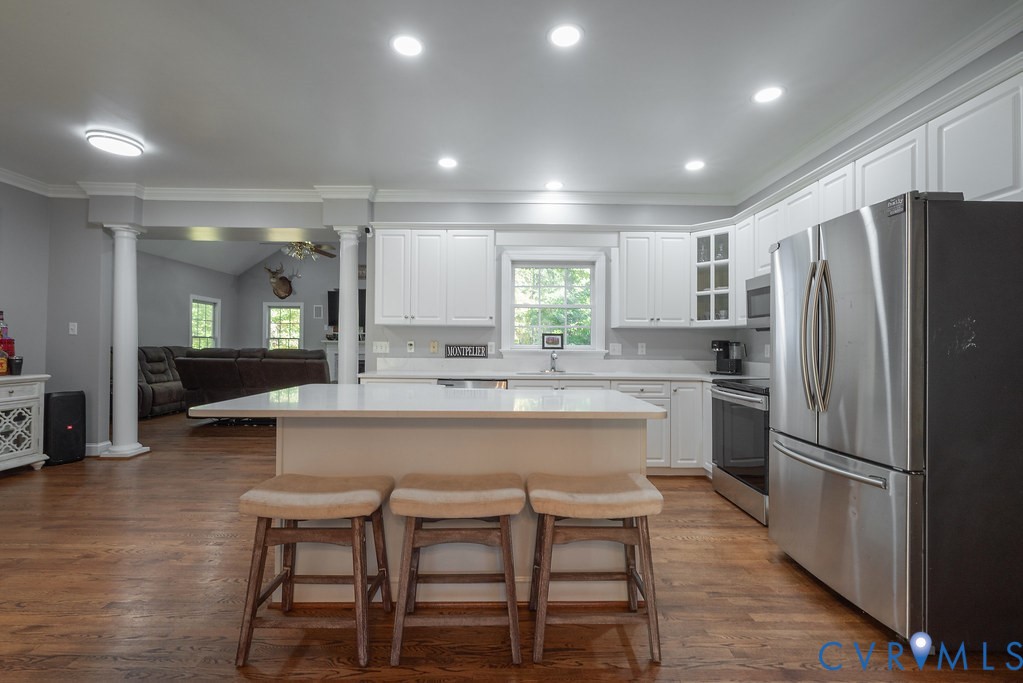 15438 West Patrick Henry Road Montpelier, VA 23192 - Photo 8 of 45 a large kitchen with a table and chairs