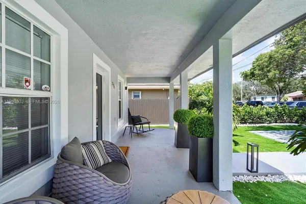 a backyard of a house with seating space