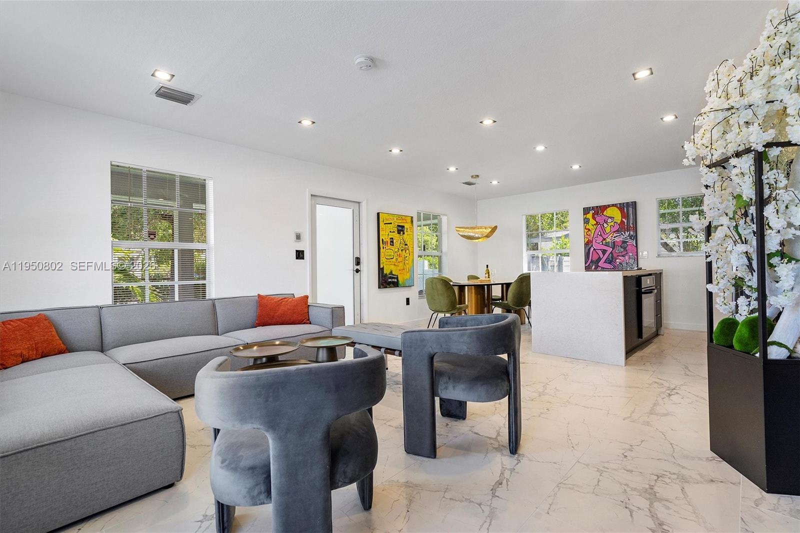 270 Northwest 41st Street Miami, FL 33127 - Photo 21 of 30 a living room with furniture and a window