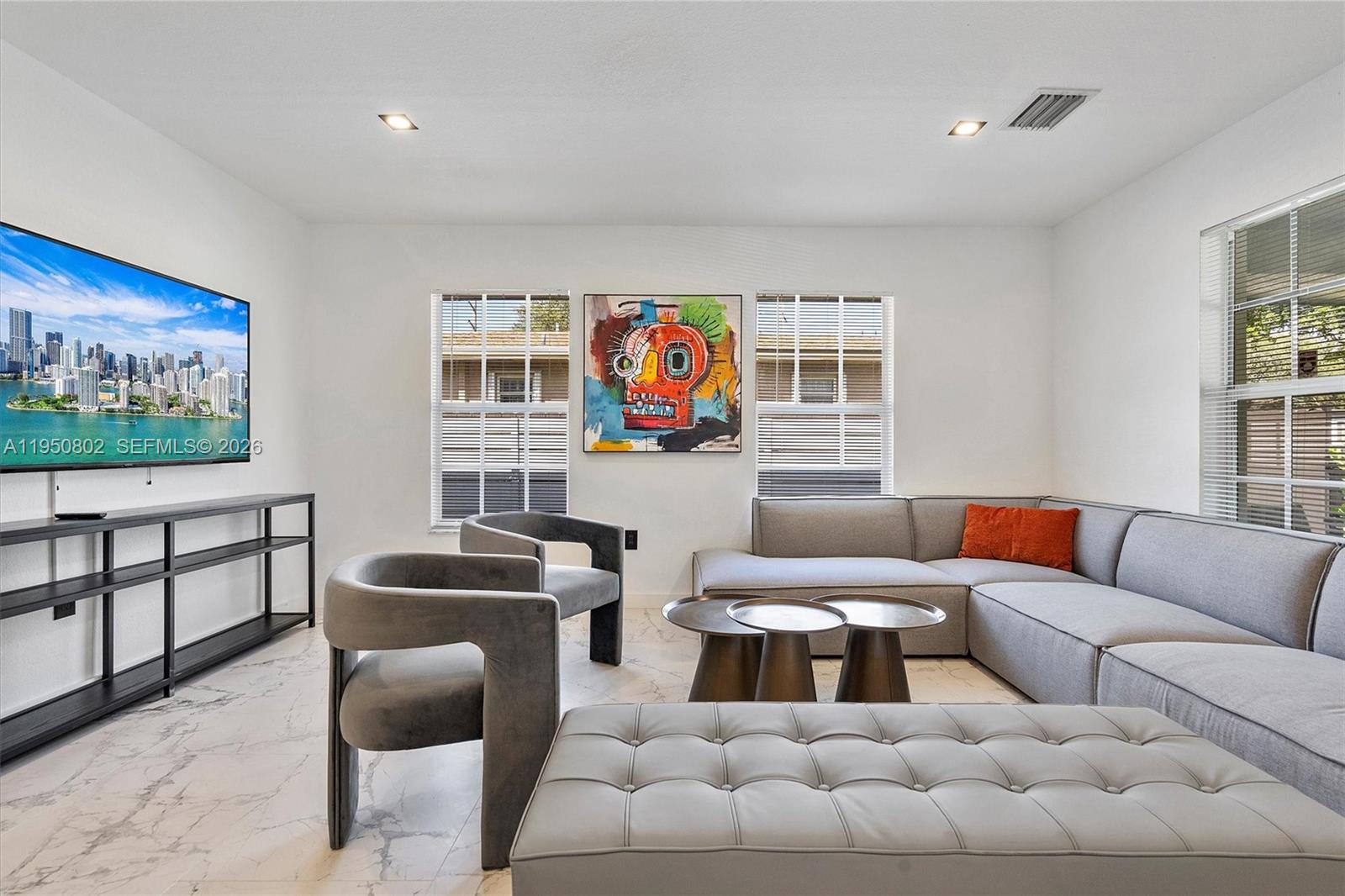 270 Northwest 41st Street Miami, FL 33127 - Photo 23 of 30 a living room with furniture a rug and a window