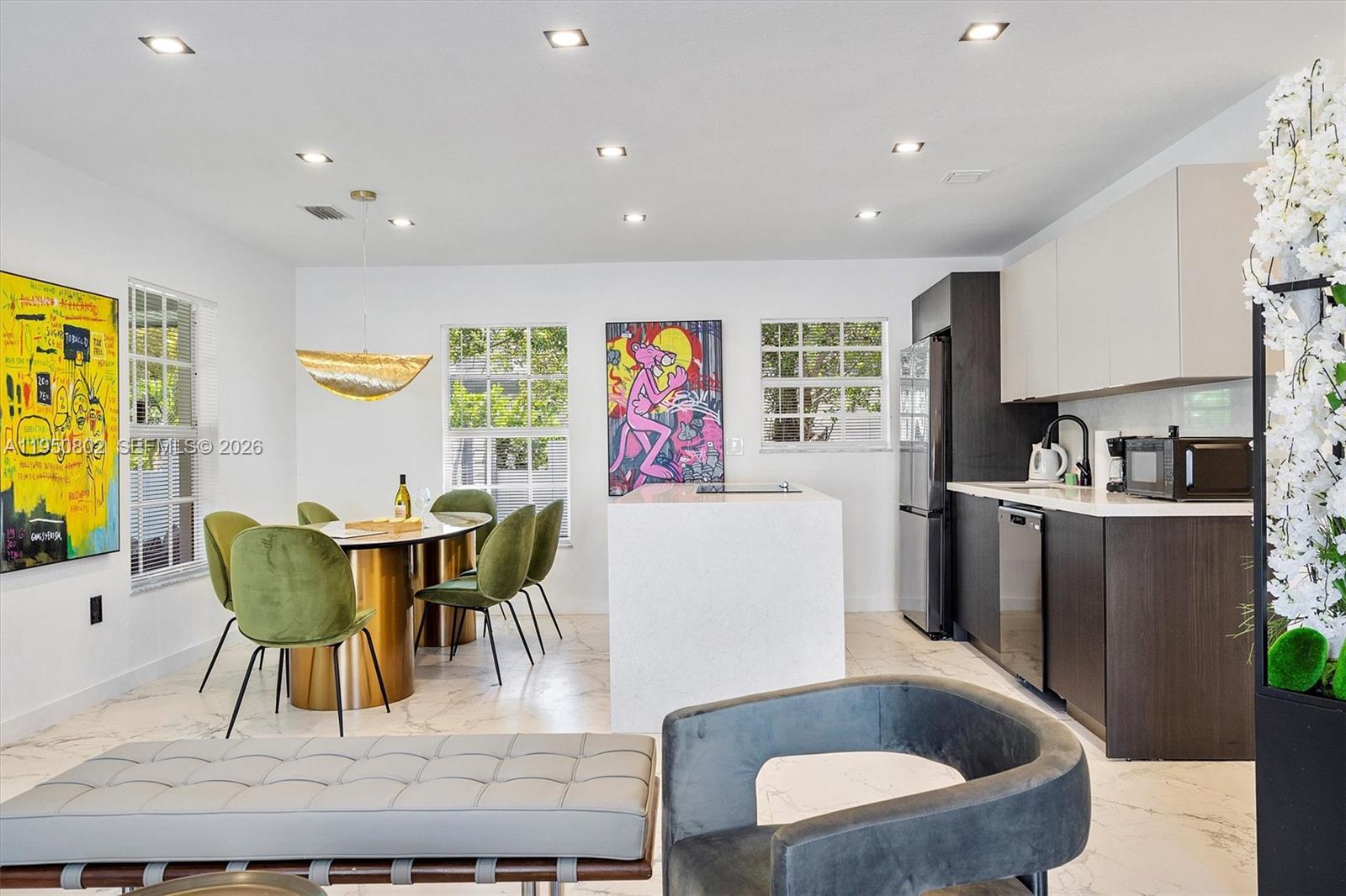 270 Northwest 41st Street Miami, FL 33127 - Photo 29 of 30 a dining room with furniture and a large window