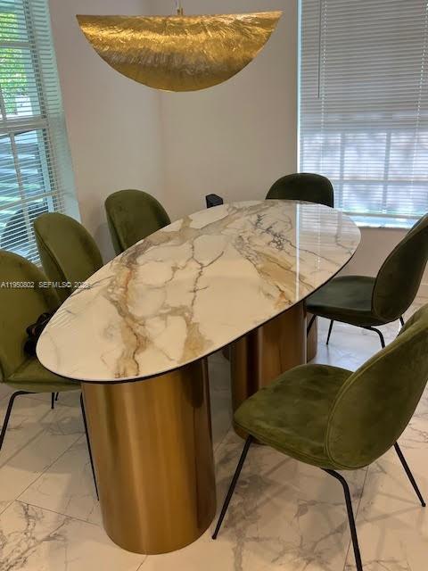 270 Northwest 41st Street Miami, FL 33127 - Photo 6 of 30 a view of a dining room with furniture and wooden floor