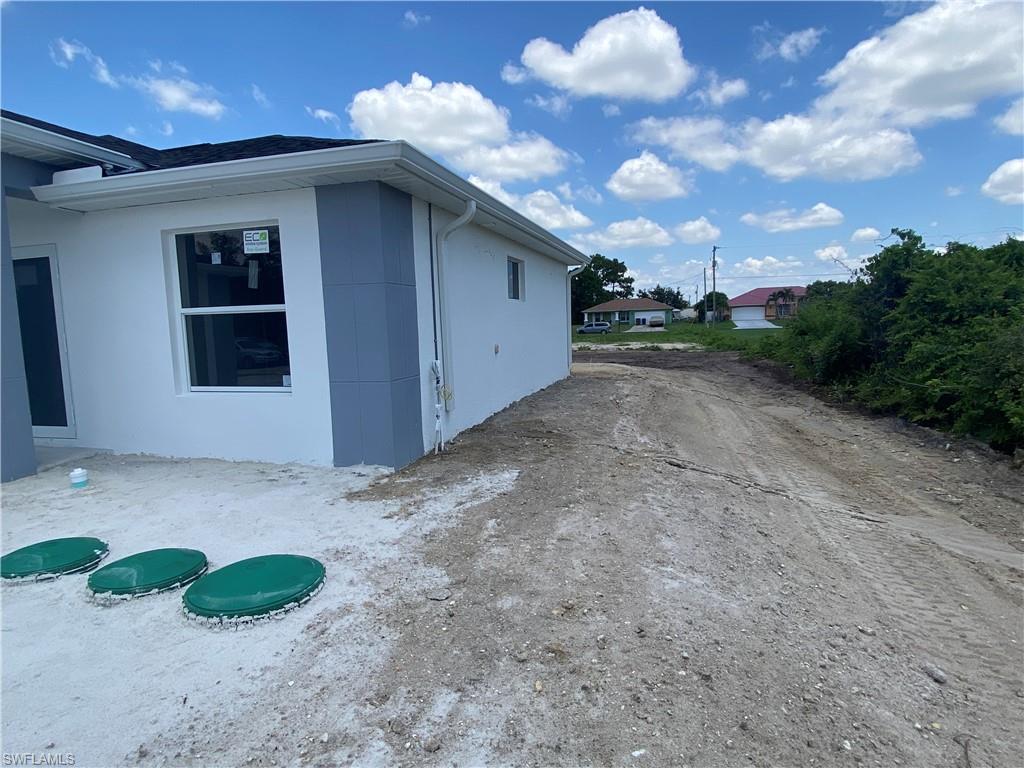 2812 15th Street Southwest Lehigh Acres, FL 33976 - Photo 11 of 13 a view of a backyard of a house