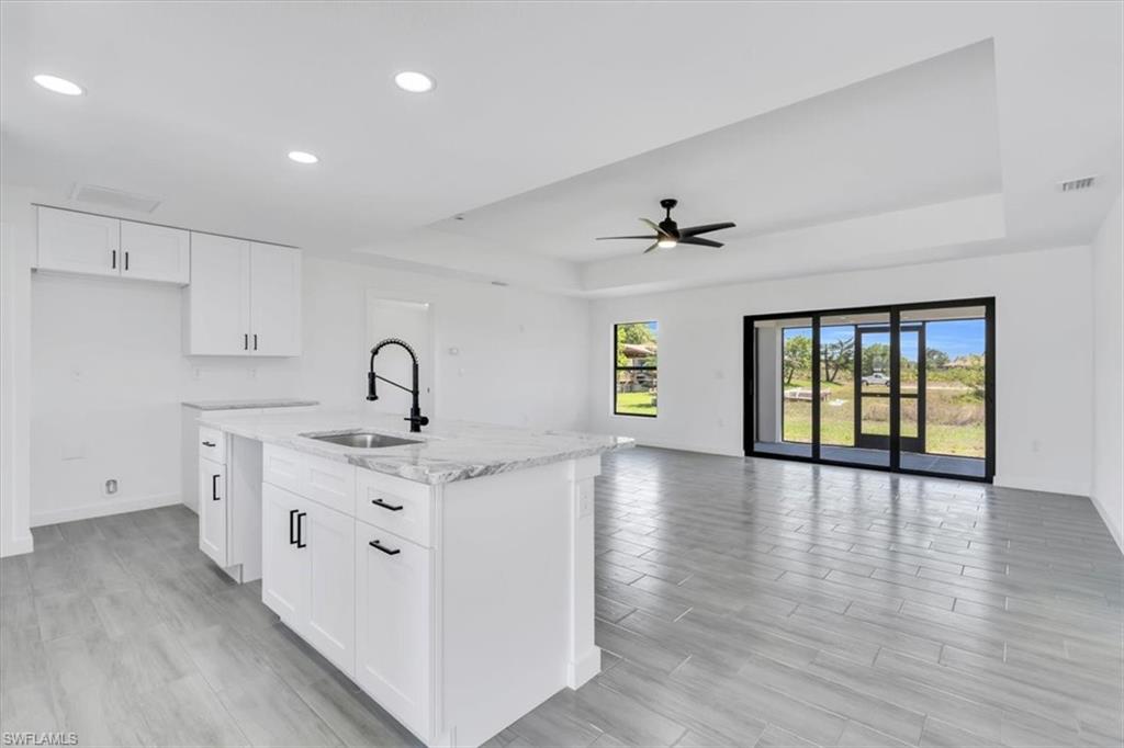 2812 15th Street Southwest Lehigh Acres, FL 33976 - Photo 2 of 13 a view of a kitchen with sink and window