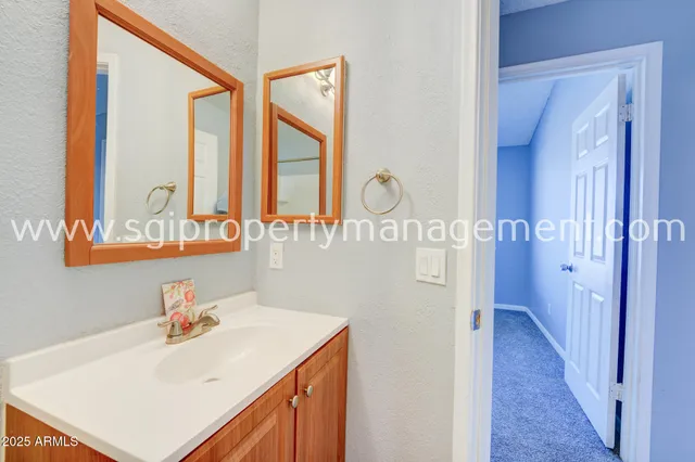 a view of kitchen with granite countertop cabinets