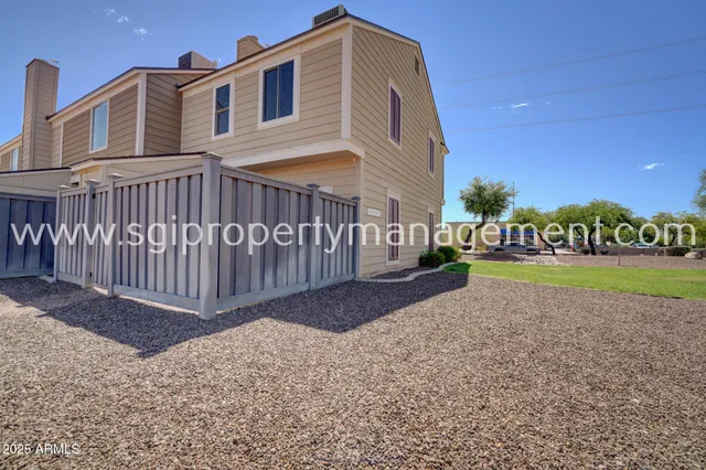 a view of a building with a yard