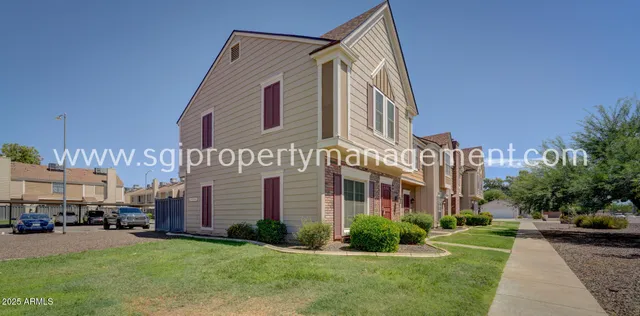 a view of a park with sitting area