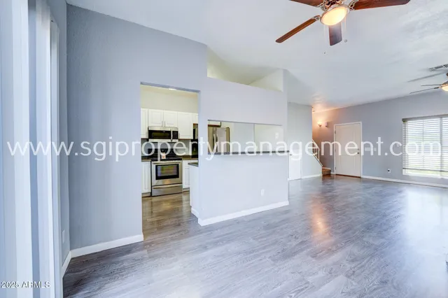 a view of a kitchen with wooden floor