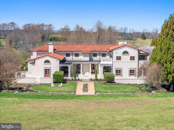 an aerial view of a house with mountain view