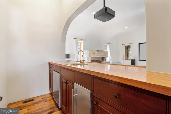 a kitchen with stainless steel appliances granite countertop a stove a sink and a white cabinets